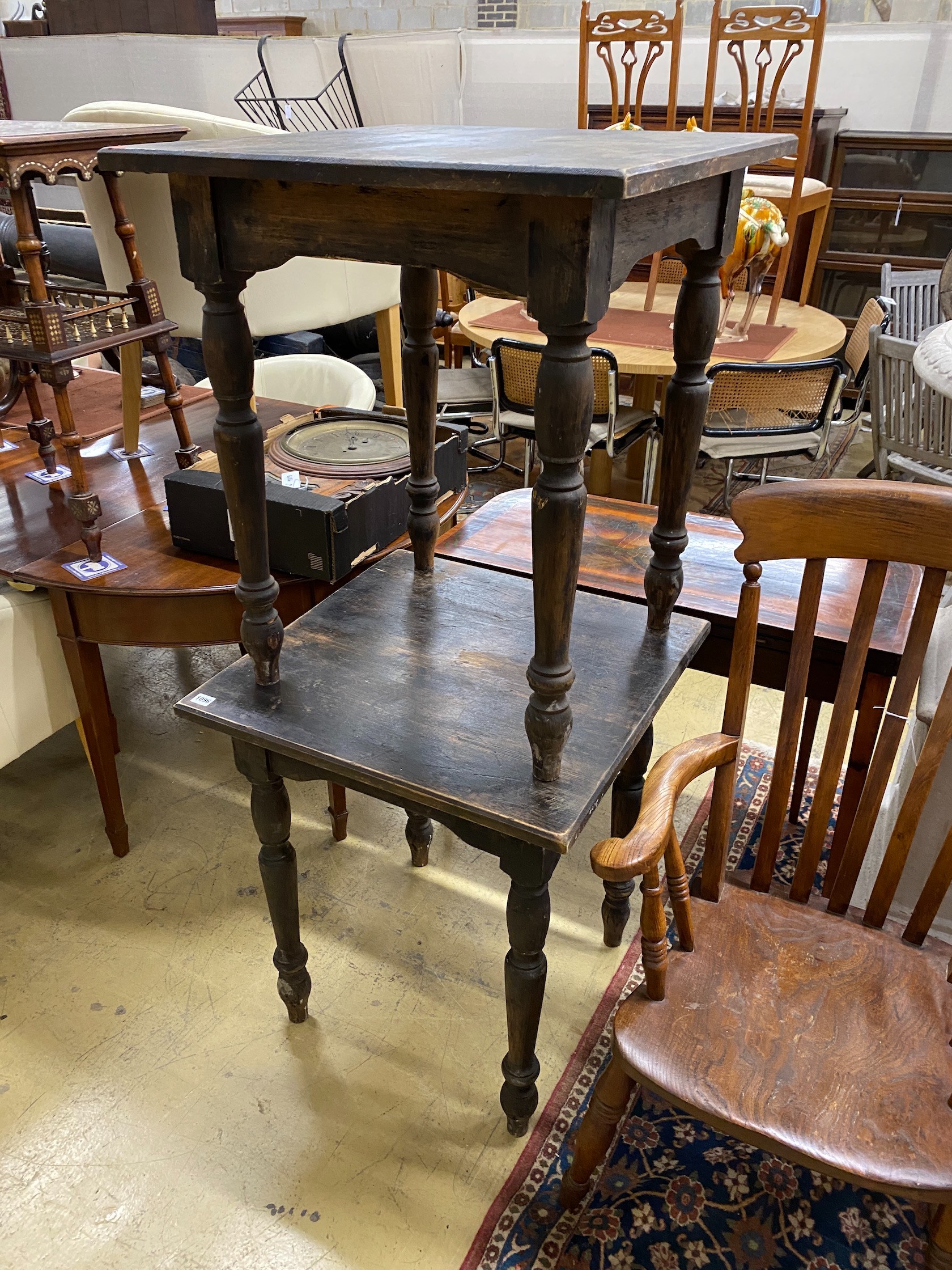 A pair of square stained pine tavern tables, width 65cm, height 75cm